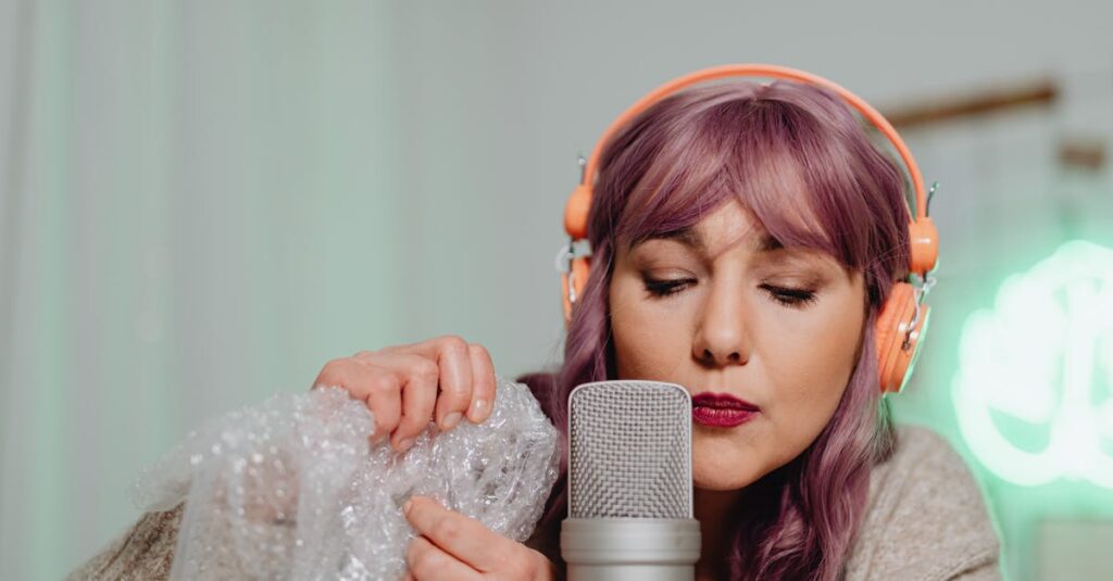 A woman with purple hair performs ASMR using bubble wrap and a microphone.